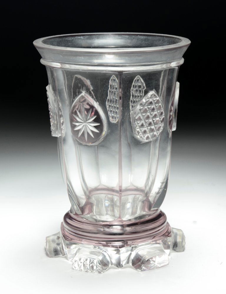Bohemian Spa Beaker: Blown clear glass with light-amethyst stain, cut back to clear. 6 facet-cuts around body, with raised diamond-cut tear drops and foot. 4.75"ht., Bohemian, circa first half 1800's.
