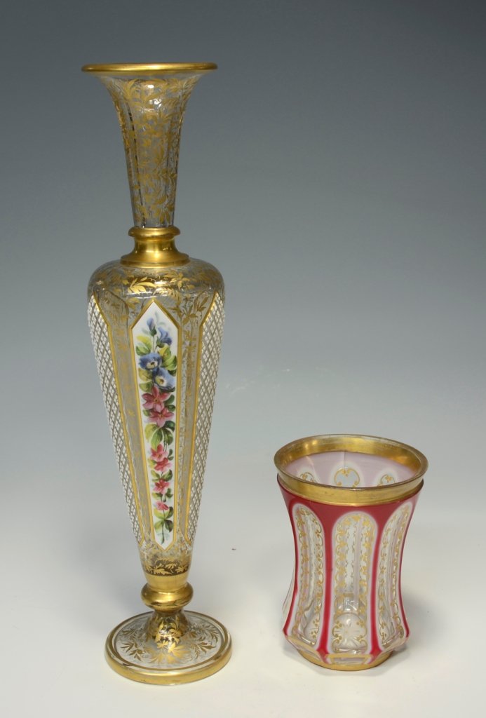 Beaker and Vase: Double overlay glass beaker, pink over white over clear, gilded. Overlay glass vase, white over clear with six alternating facet-cut panels. Three have diamond-cuts and three have floral enamel. Ornam