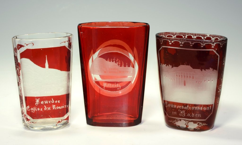 Group of Pocket Beakers: Clear glass ruby stained and wheel-cut church scene. 3.25"ht., Engraved town scene. 3.75"ht., Engraved scene of Baden. 3.25"ht.,Bohemian, circa 1875.