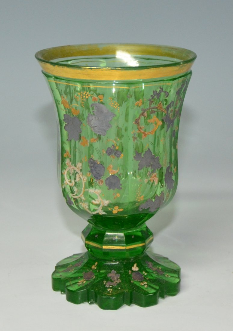 Green Glass Beaker: Blown green glass, facet-cut bowl, stem, and foot. Scalloped-cut foot. Painted with silver and gilt decoration. 5.75"ht., Bohemian, circa 1840.