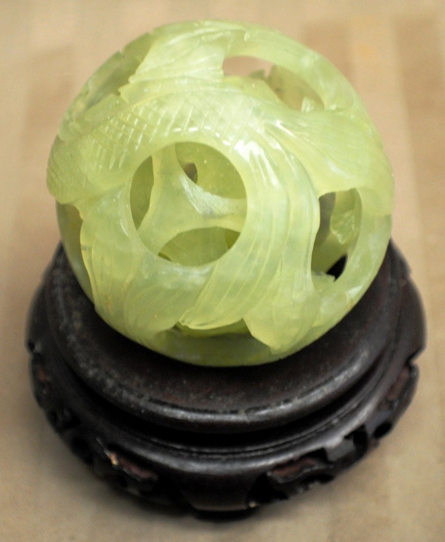 Chinese jade puzzle with wooden stand: Chinese jade puzzle 2 ½’ DIAMETER with wooden stand