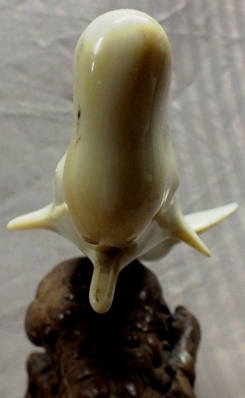 John Perry Dolphin sculpture on burl wood base: John Perry Dolphin sculpture on burl wood base, 9” tall, signed
