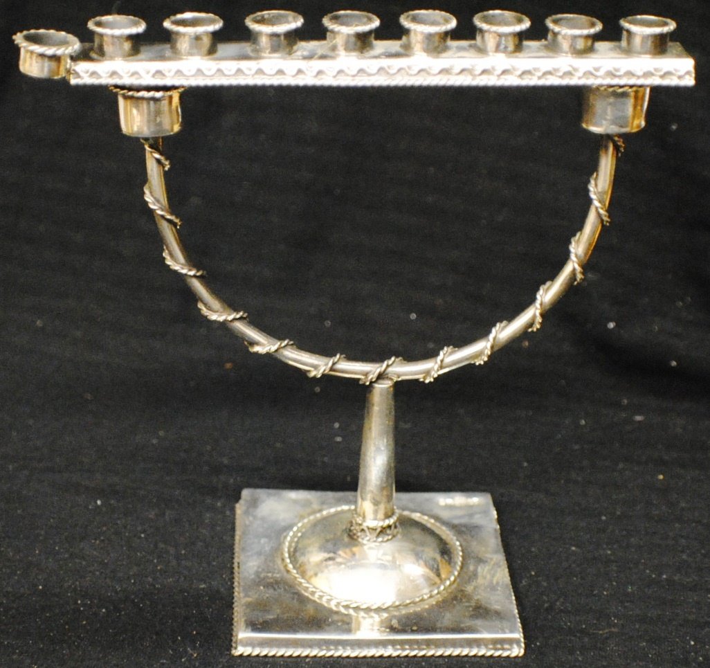84 Russian Silver Menorah: 84 Russian Silver Menorah. 3 parts, 5 ½” tall, 5” wide,baase 2 ½’ x 2 ½”, 70 gram. Hallmarked 1873