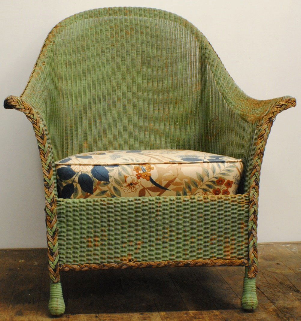 Antique wicker arm chair