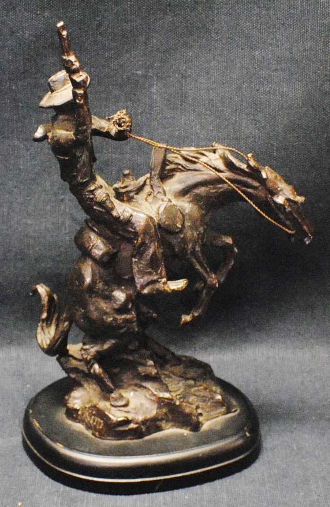 Frederic Remington style bronze sculpture: Frederic Remington style bronze sculpture 9 ½” tall, base 6” x 4”, 4.2 lb. Circa mid 1900’s AS pictured. 9 of 10