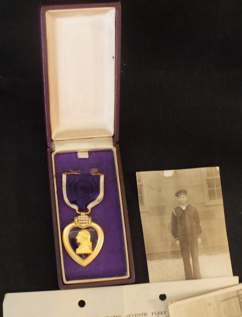 Purple Heart medal with paperwork and photographs: Purple Heart medal with paperwork and photographs of Samuel Norris, 1944-1945