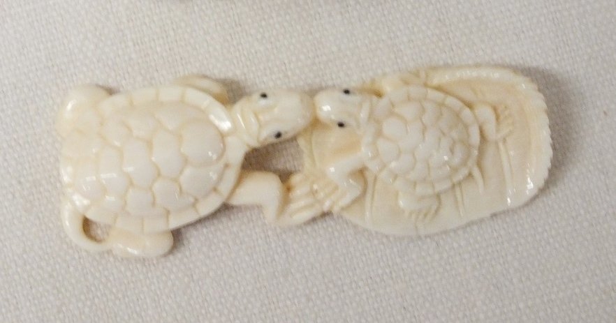 Netsuke, carved in China from Russian Mammoth: Netsuke, carved in China from Russian Mammoth. 2 1/4" x 3/4", signed, Circa second half of 20'th Century