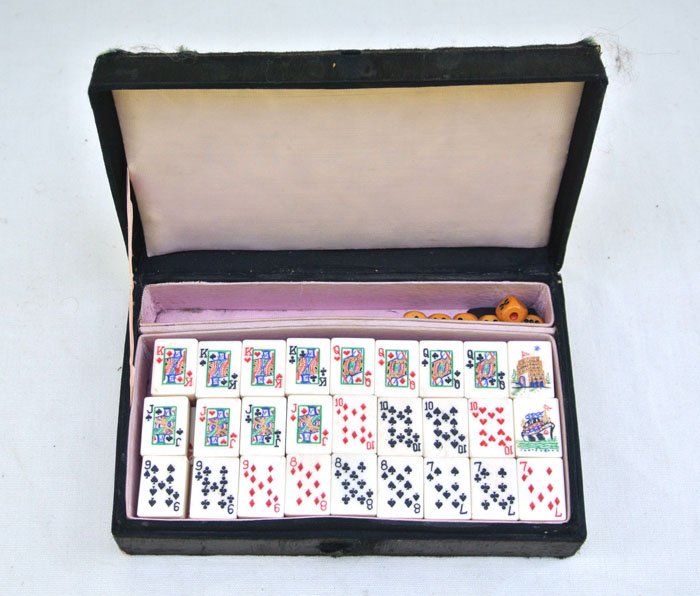 Chinese travel tile playing cards set: Chinese travel tile playing cards set. Case 7" x 4" x 2" with needlepoint on the top. Bamboo and bone tiles. Circa late 1800's.