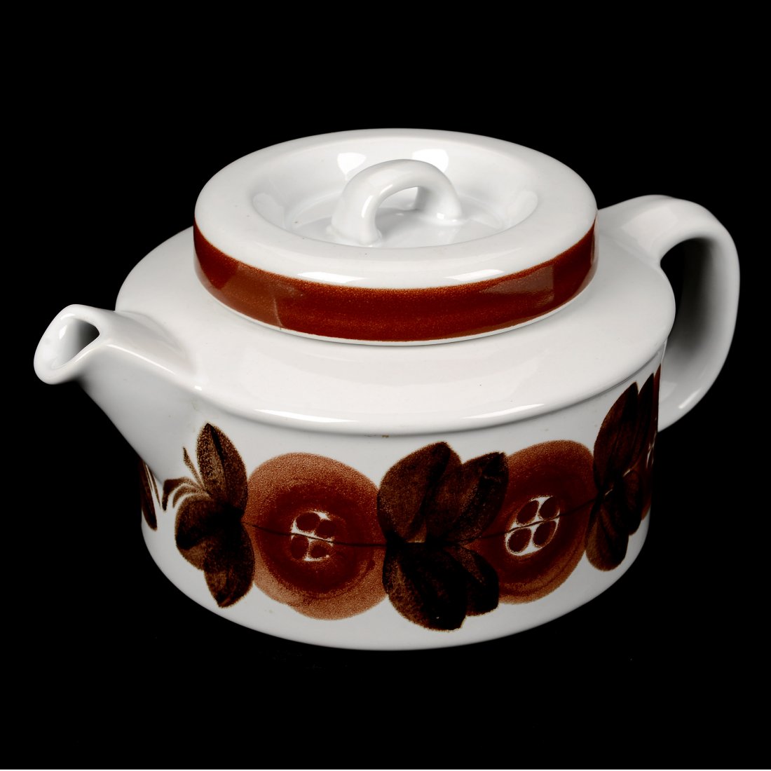 TEKANNA, porslin, "Anemone", ULLA PROCOPÈ för Arabia: Dekor av bruna blommor mot vit botten. Originalsil medföljer. Smärre slitage. Höjd 11.5, diameter 23 cm.
