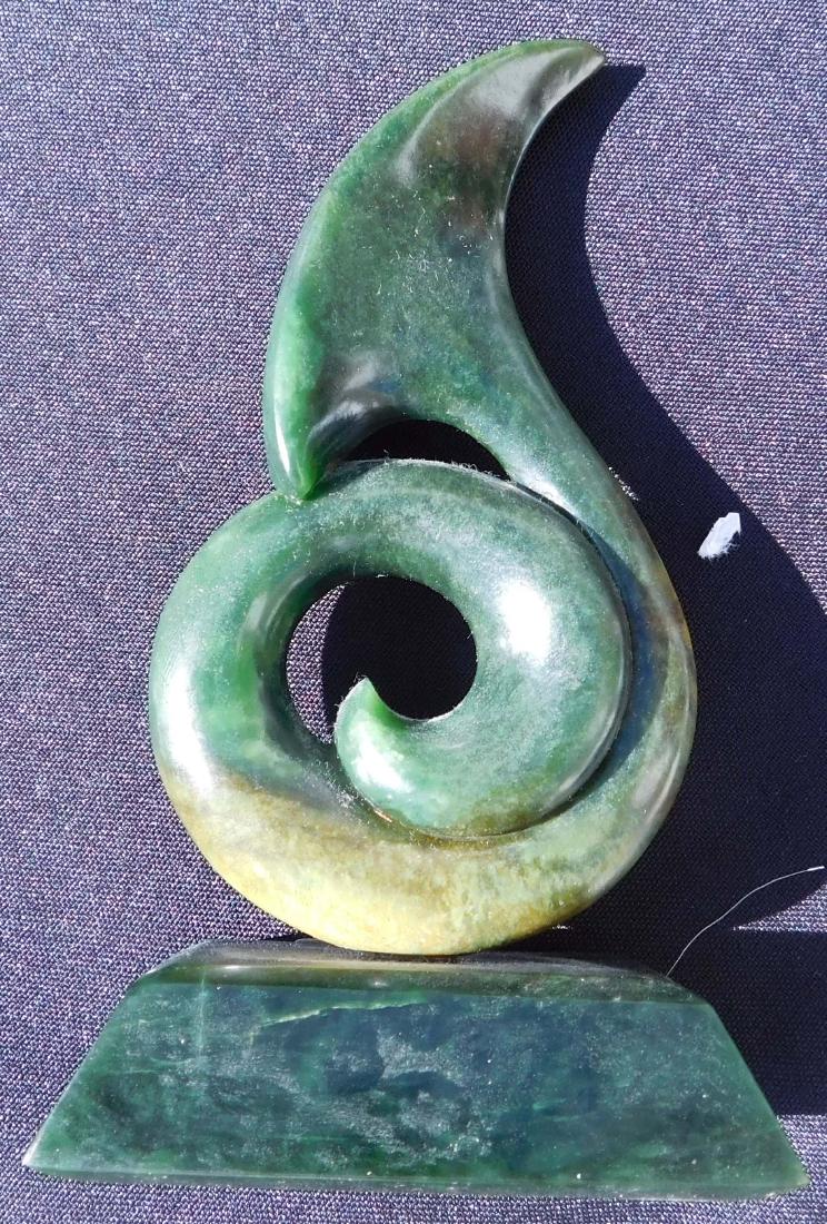 New Zealand Jade Whale Tale: New Zealand Jade Whale Tale, 20 th century item. Made of jade on a metal stand, the item measures 5.75" x 3.25" x 2". New Zealand, Maori. Artist Neil D. Brown. Condition: Fine, see images. Shipping: $