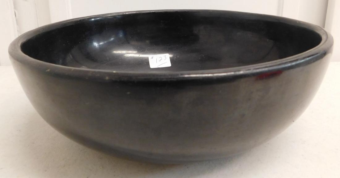 Maria & Santana Bowl: Maria & Santana Bowl, circa 1940s. Made of clay and black paint, the item measures 9.75" x 9.75" x 3.25". San Ildefonso Pueblo. Classic Maria pottery. Condition: Some wear, see images. Shipping: $30.0