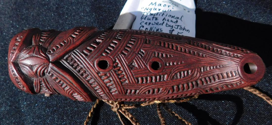 New Zealand Maori Nguru Flute: New Zealand Maori Nguru Flute, 20th century item. Made of hardwood and shell inlay, the item is 4.5" x 1.5" x 2". Carved by John Collins. Condition: Fine, see images. Shipping: $16.50 w/insurance and 