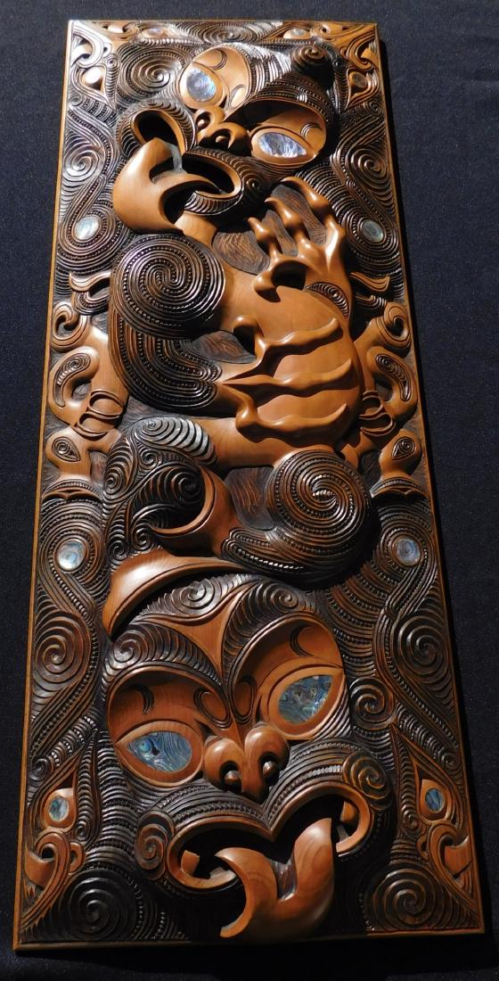 New Zealand Maori Carved Wood Panel: New Zealand Maori Carved Wood Panel, 20 th century item. Made of hardwood with shell inlay, the item measures 11.25" x 30" x 1.75". Maori, Rangi Redman. Beautiful wood wall panel carving w/large shell