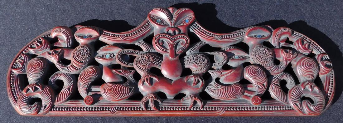 Maori Carved Inlaid Wood Door Lintel: Maori Carved Inlaid Wood Door Lintel, 20 th century item. Made of hardwood and shell inlay, the item is 27" long x 9.25" x 1.5'. New Zealand, Maori. Heavily carved with several figures and inlaid shel