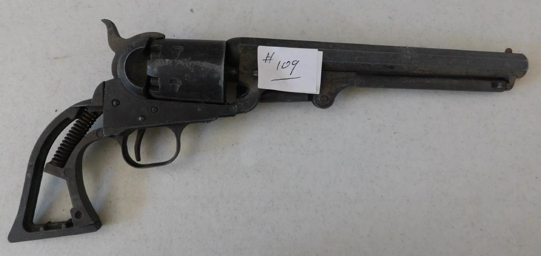 Old 6 Shooter Wall-Hanger: Old 6 Shooter Wall-Hanger circa 1930s. Made of iron and steel, the item measures 12.5" x 5.5" x 1.5". USA. Condition: Wall hanger, see images. Shipping: $24.50 w/insurance and signature.
