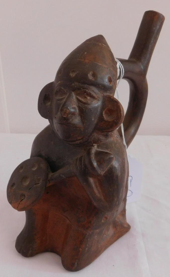 Clay Figure: Clay Figure, age unknown. Made of clay and paint, the item measures 4.5" x 7" x 9". South America. Nice, older vessel with handle and spout, appears to have been used for drinking. Condition: Crack & 