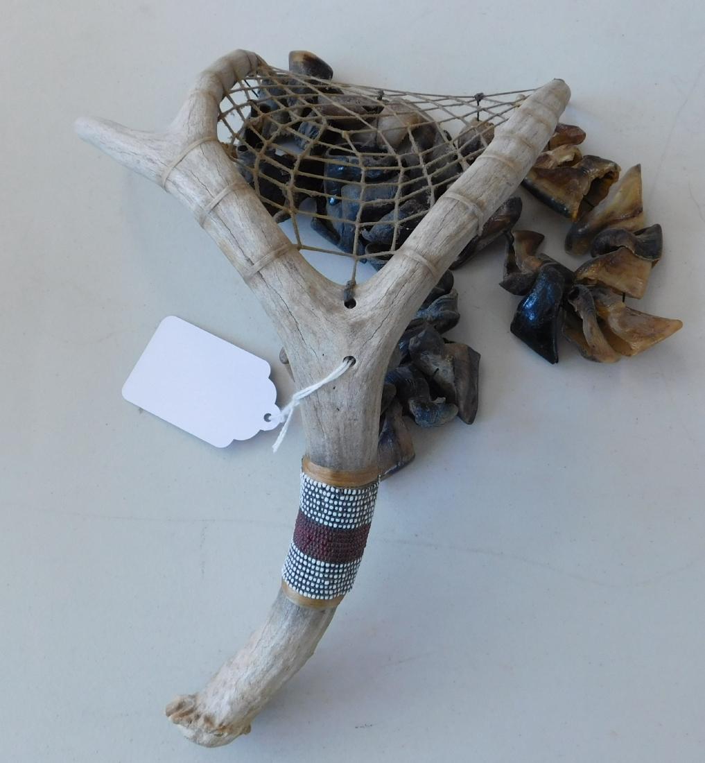 Deer Toe Rattle: Deer Toe Rattle, circa 1960s. Made of bone, sinew, glass and antler, the item measures 12" x 7" x 7". California. Nice sound. Condition: Good, see images. Shipping: $32.50 due to size, w/insurance and