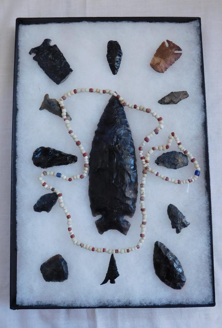 California Artifact Collection: California Artifact Collection, pre-historic items. Made of obsidian, the items measure from 1.25" to 6" long. Central California. Frame not included. Condition: As found, see images. Shipping: $25.50