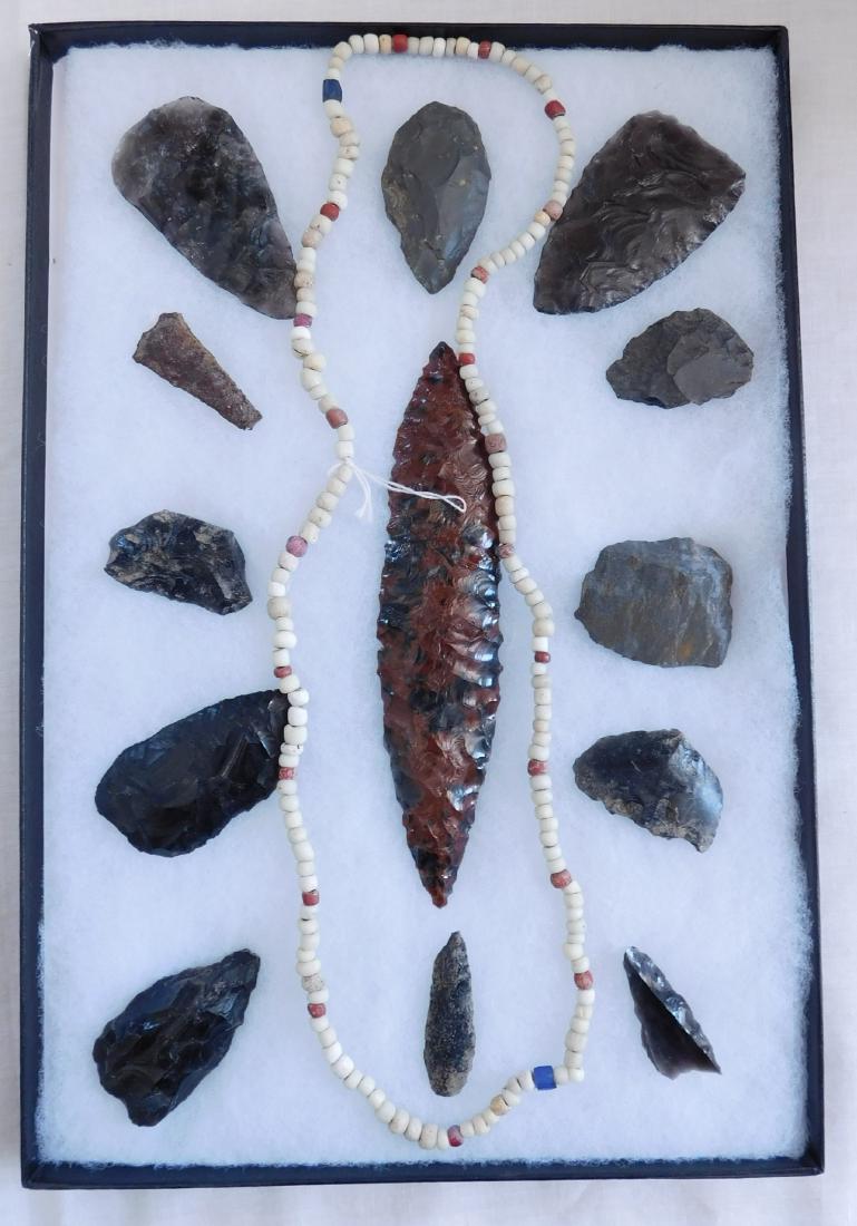 California Artifact Collection: California Artifact Collection, pre-historic items. Made of obsidian, the items measure from 1 1/2" to 5 7/8" long. Central California. Frame not included. Condition: As found, see images. Shipping: $