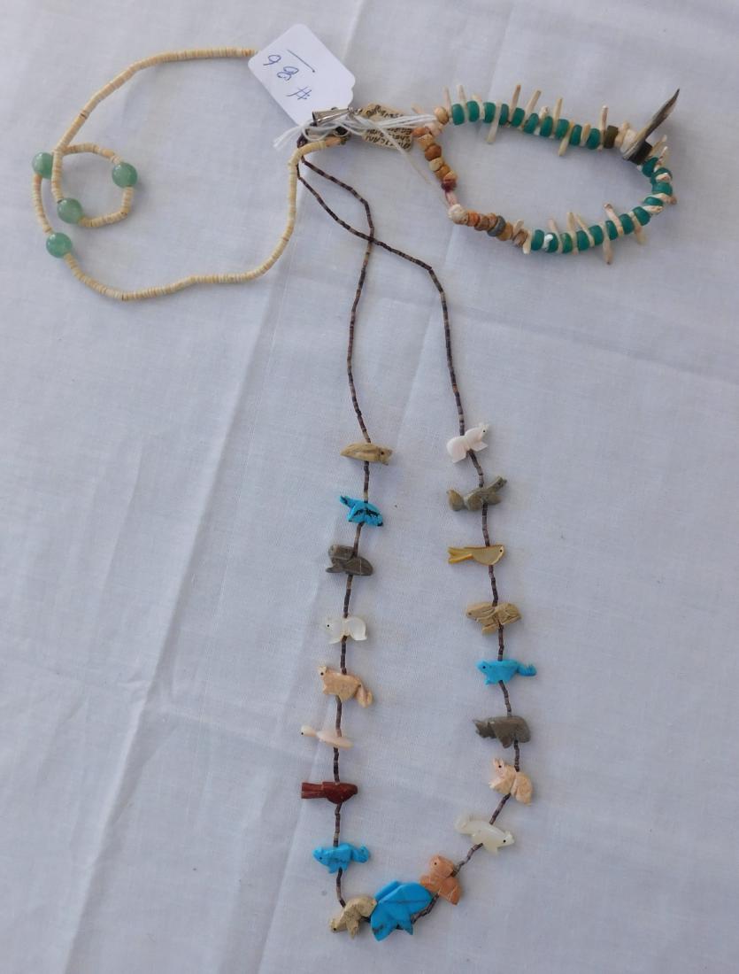 Fetish Necklace + 2 Pieces: Fetish Necklace + 2 Pieces, circa 1980s. Made of stone, metal, shell, turquoise, etc., the necklace hangs 14" as worn, 3" opening on bracelet and 8" choker as worn. Southwest USA, Mexico. 19 fetishes 