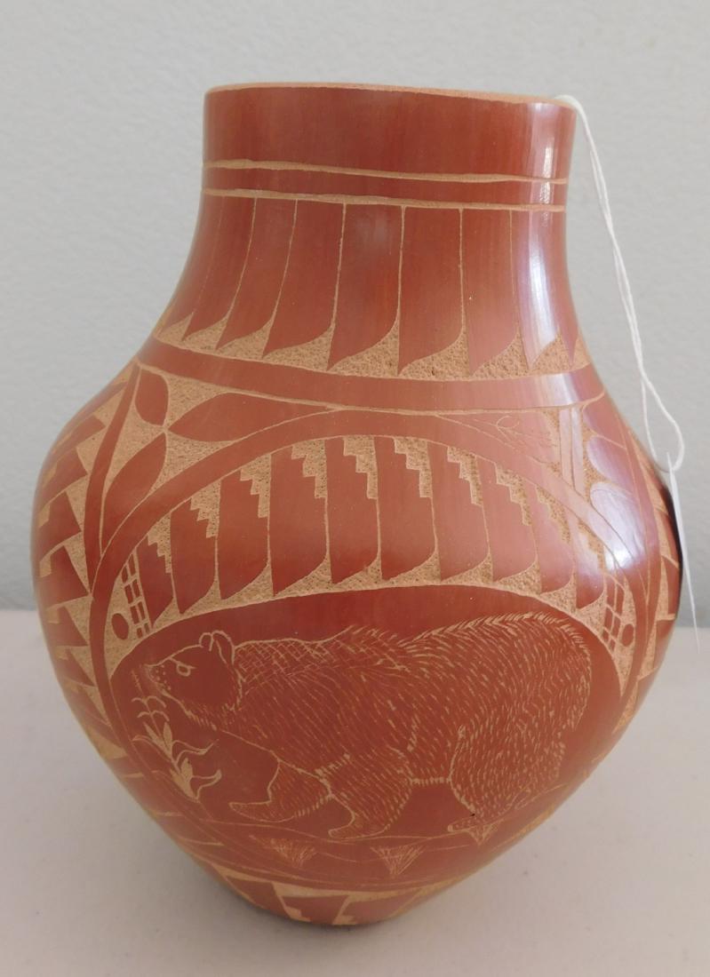 Jemez Carved Olla w/Effigies: Jemez Carved Olla w/Effigies, c. 1980s. Made of clay and paint, the item measures 6.5" x 6.5" x 8". Jemez, New Mexico. Clara Gachupin. Red olla with bear, buffalo effigies. Condition: Good, see images