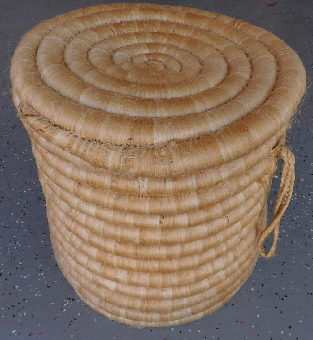 Large Inmate-Made Colombian Basket: Large Inmate-Made Colombian Basket, c. 2000s. Made of fiber and rope, the item measures 18" x 18" x 19" tall. Coil basket with lid. Heavy item, was purchased in Colombia at a prison and brought back t