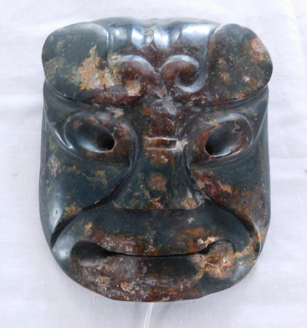 Chinese Jade Mask: Chinese Jade Mask, Ming dynasty. Made of jade, the item measures 5.5" x 7" x 1". Central China. Classic style features on this mask. Condition: Good, see images. Shipping: $24.50 w/insurance and signa