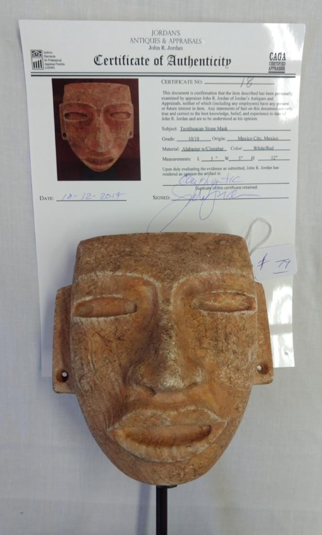 Teotihuacan Stone Mask w/John Jordan COA: Teotihuacan Stone Mask w/John Jordan COA, pre-Columbian item. Made of alabaster and cinnabar with a metal stand, the item measures approx. 6 1/2" x 6 3/4" x 4", stand measuring 5" x 5" x 12". Mexico C