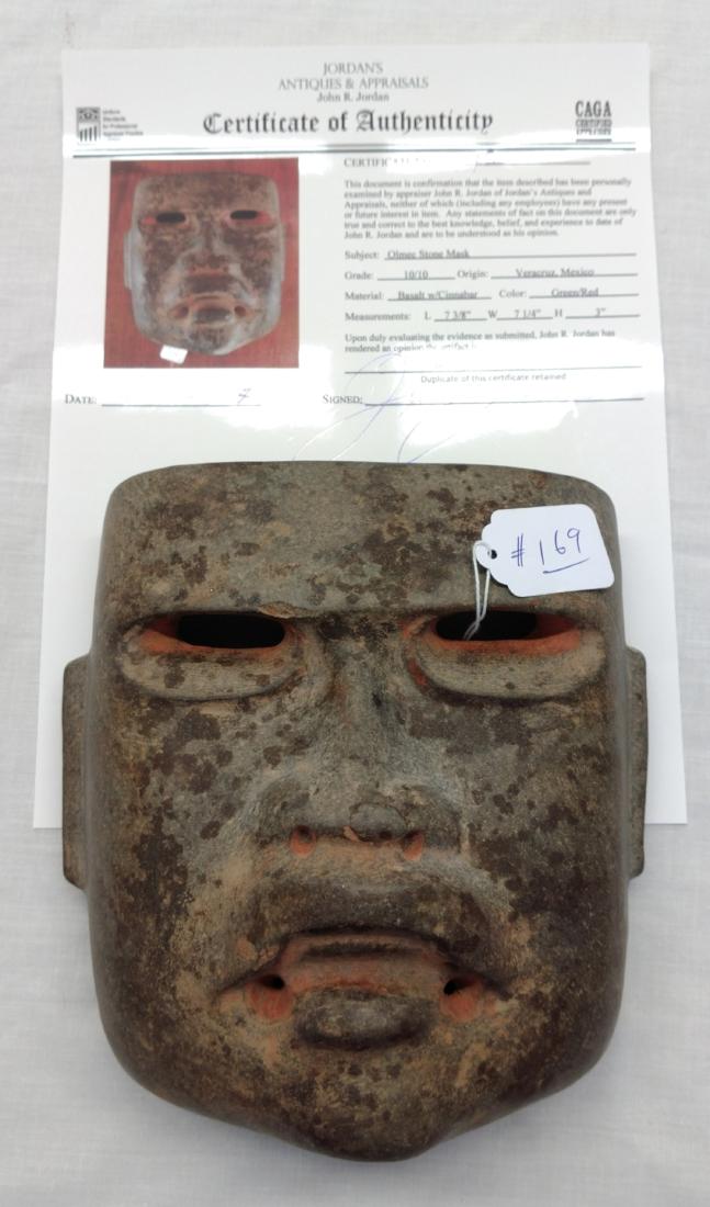 Olmec Stone Mask w/John Jordan COA: Olmec Stone Mask w/John Jordan COA, pre-Columbian item. Made of basalt and cinnabar, the item measures 7 3/8" x 7 1/4" x 3". Veracruz, Mexico. From an old, 1960s California collection. John R. Jordan