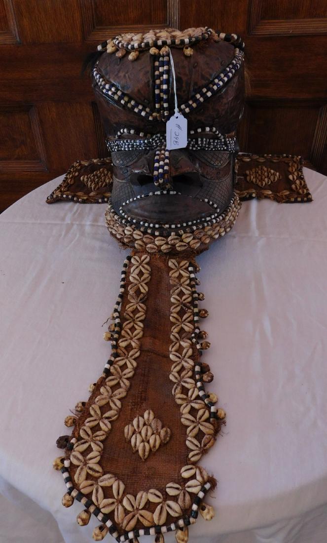 African Kuba Mboom Royal Helmet Mask: African Kuba Mboom Royal Helmet Mask, early 20th century. Made of cloth, cowrie shells, copper, wood, glass beads, the item measures 8" x 14" x 11". Kuba tribe, Central Africa, Congo. Copper inlay on 