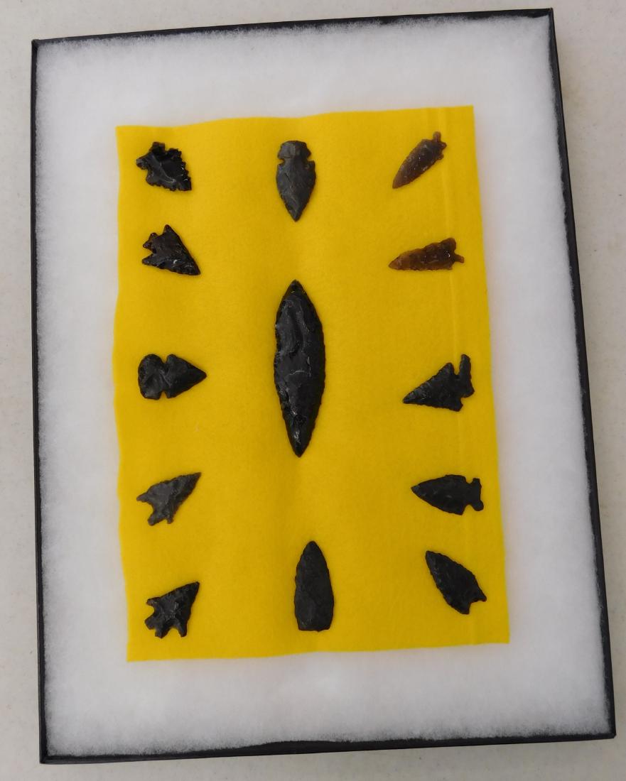 California Obsidian Collection: California Obsidian Collection, pre-historic items. Made of obsidian, the longest measures 4". Sonoma County, California. Many paleo points, many with nice bases. Frame not included. Condition: As fou