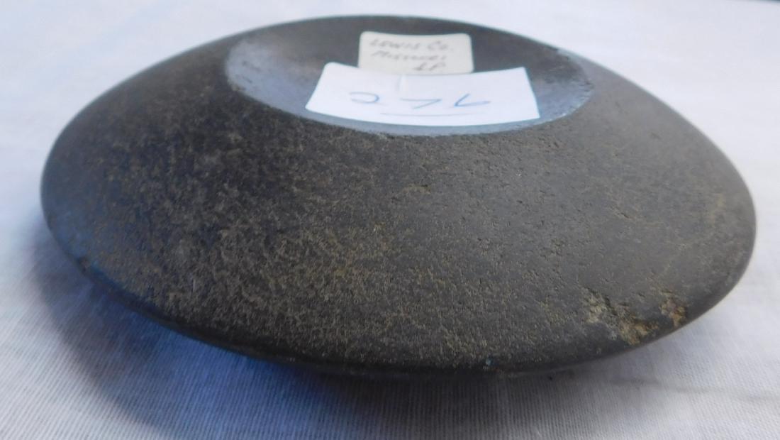 Discoidal Game Stone: Discoidal Game Stone, pre-historic item. Made of basalt, the item measures 4 1/4" x 4 1/4" x 1". Lewis County, Missouri. Salt river type, UFO-look to the artifact. Condition: Peck marks remain, see im