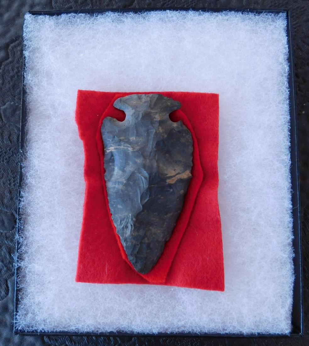 Classic Dovetail Point w/Helm COA: Classic Dovetail Point w/Helm COA, pre-historic item. Made of black chert, the item measures 3 1/4". Scioto County, Ohio. Helm Certificate of Authenticity. Condition: Barb ding, see images. Shipping: