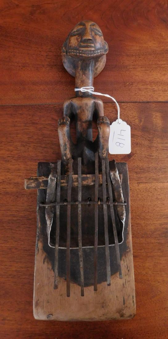 Kalimba Finger Piano: Kalimba Finger Piano, mid 20th century item. Made of steel and wood, the item measures 18". Luba, Congo. Nice sound. Condition: Some wear, see images. Shipping: $24.50 w/insurance and signature.