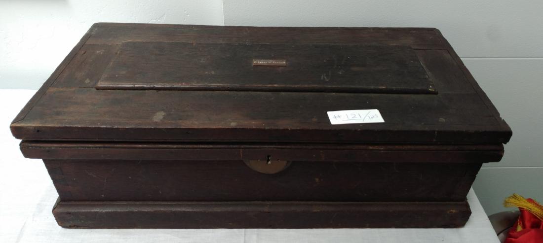 Chest from James Flagg: Chest from James Flagg, early 20th century item. Made of wood and brass, the item measures 25" x 9" x 10". American. Lot also includes old Jockey pants and belt, pants measuring 35" long and belt 35" 