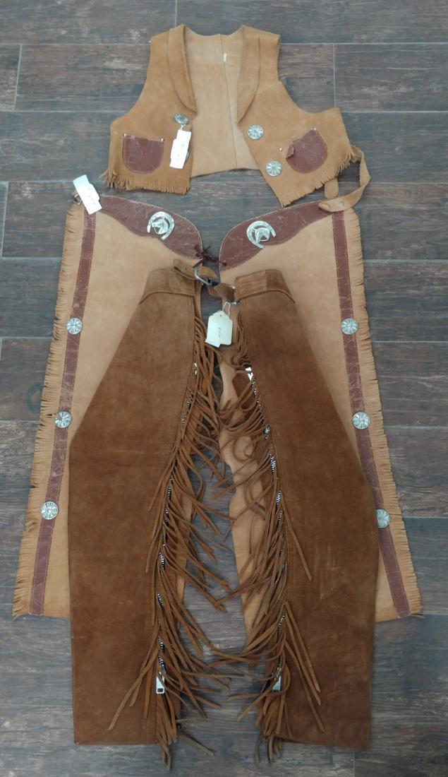 Child Chaps & Vest Set: Child Chaps & Vest Set, c. 1950s. Made of leather, and metal buckles, one pair measures 30" and the other 31". Vest measures 13" in length. Condition: Worn, see images. Shipping: $22.50 w/insurance an