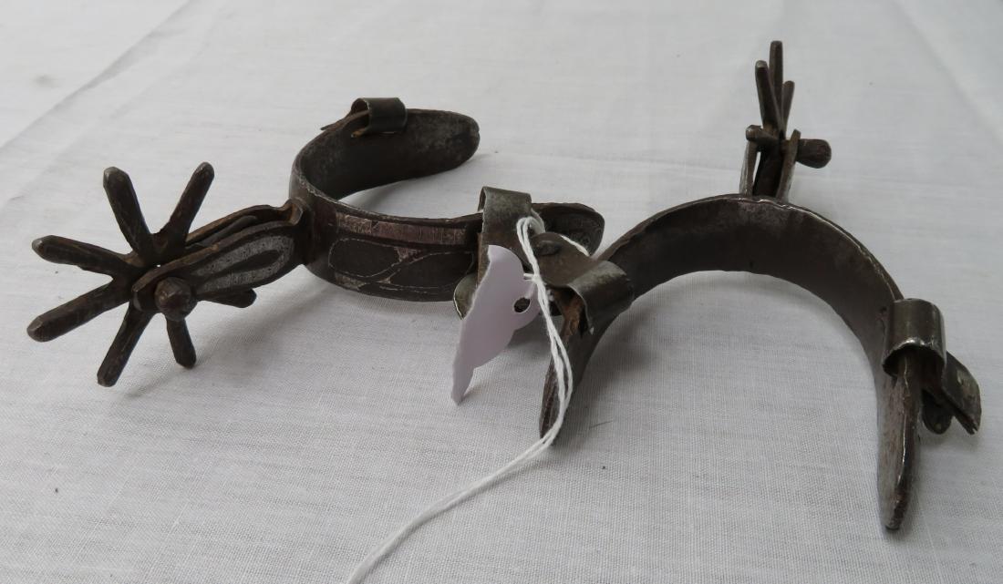 Pair of Antique Mexican Spurs: Pair of Antique Mexican Spurs, early 20th century items. Made of steel and silver, these spurs could be women's or child's as they only measure 5 inches. Mexico. Condition: Worn, no leather straps, se