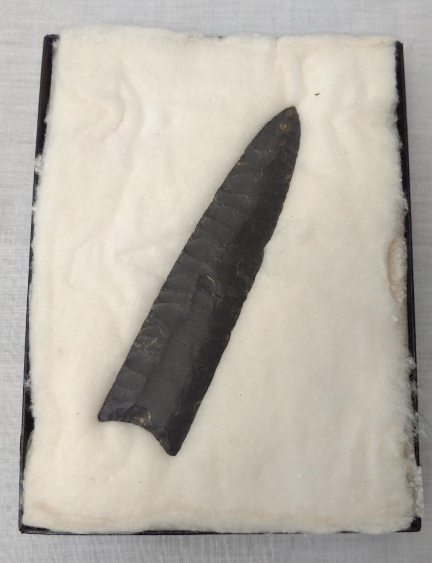Giant Clovis Point: Giant Clovis Point, age unknown. Made of black chert, the item measures 6 1/2". Bell County, Texas. Nice flute on both sides. Frame not included. Condition: Good, see images. Shipping: $20.00 w/insura