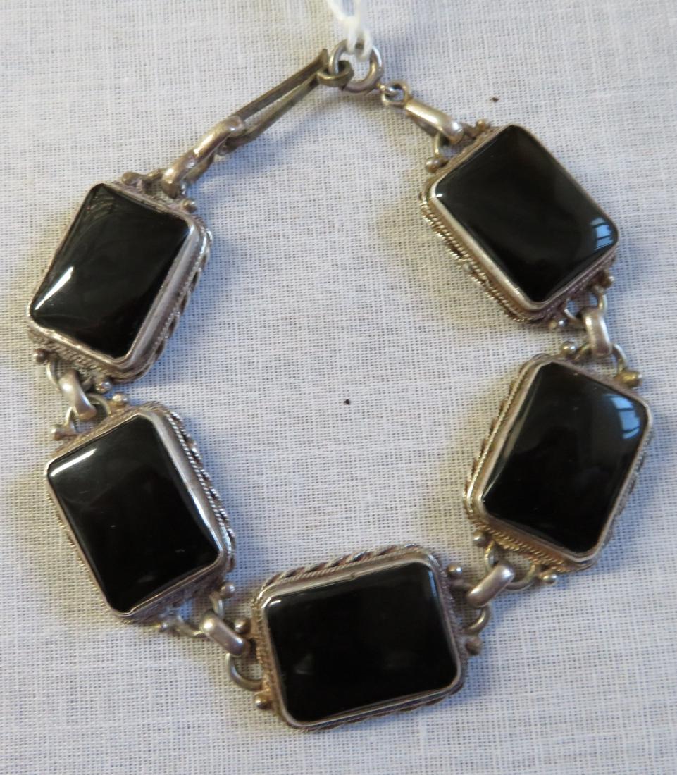 Mexican Handmade Sterling & Stone Link Bracelet: Mexican Handmade Sterling & Stone Link Bracelet, c. 1930s. Made of sterling silver and stone, possibly jet or onyx, the item measures 6" x 1/2" x 1/8". Mexico. Weighs approx. 26.7 grams. Condition: Go