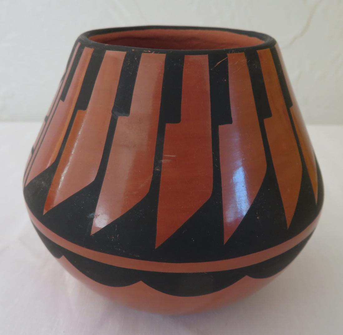 L. Loretto Jemez Olla: L. Loretto Jemez Olla, c. 1990s. Made of clay and paint, the item measures 4" x 4" x 3 1/2". Jemez Pueblo, New Mexico. Great shine to this small pot. Condition: Good, some wear, see images. Shipping: 