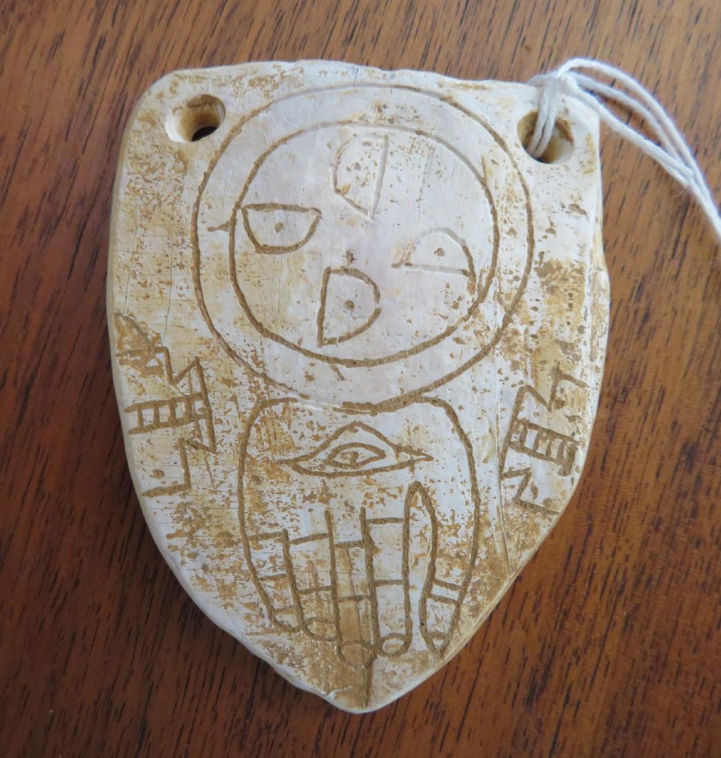 Hopewell Shell Gorget: Hopewell Shell Gorget, Hopewell era item. Made of shell, the item measures 2 1/2" x 3 3/8" x 1/4". St. Charles County, Missouri. Heavily engraved. Condition: As found, see images. Shipping: $16.50 w/i