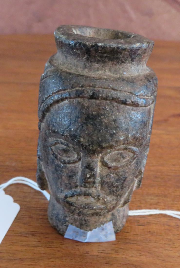 Human Effigy Pipe: Human Effigy Pipe, pre-historic item. Made of steatite, the item measures 1 5/8" x 1 7/8" x 3". North Carolina. Condition: As found, see images. Shipping: $16.50 w/insurance and signature.