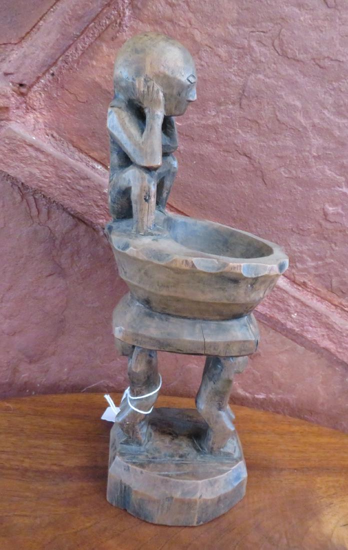 Philippines Human Effigy Cup: Philippines Human Effigy Cup, early 20th century item. Made of hardwood, the item measures 11" tall. Igorot. Condition: Nice patina, see images. Shipping: $26.50 w/insurance and signature, due to leng