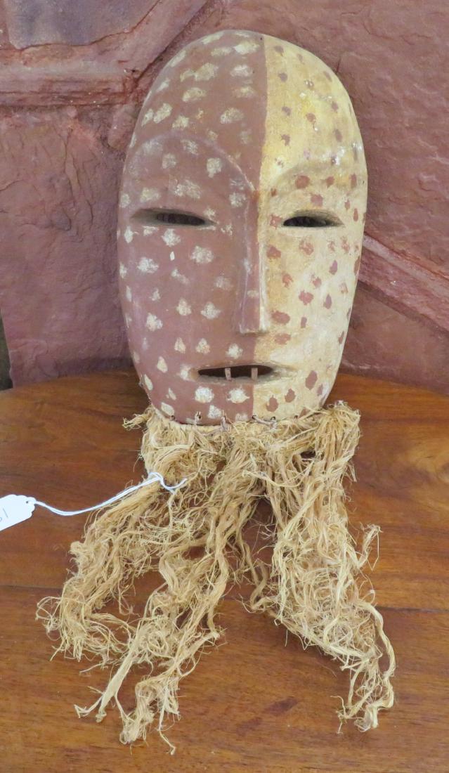 African Wood Mask: African Wood Mask, late 19th century item. Made of wood, paint and raffia, the item is 12" long. Possibly Pende, Congo. Condition: Good, see images. Shipping: $24.50 w/insurance and signature.