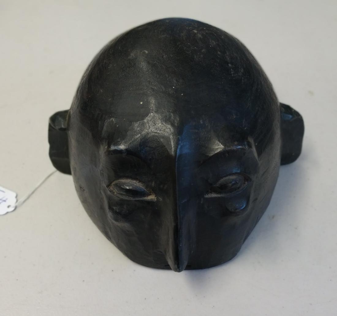 Indonesian Helmet Mask: Indonesian Helmet Mask, c. 100 years old. Made of wood, the item measures 10" x 8" x 5". Indonesia. Human mask. Condition: Good, see images. Shipping: $18.50 w/insurance and signature.