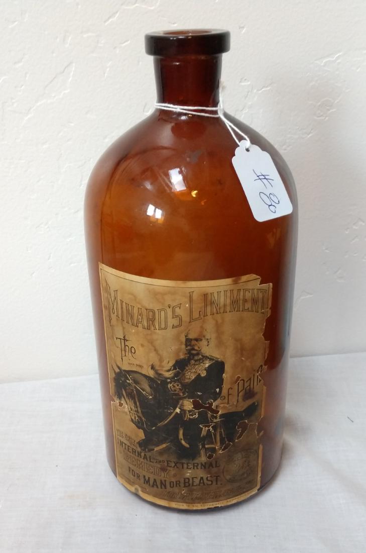 Authentic Reproduction Minards Liniment Bottle: Authentic Reproduction Minards Liniment Bottle, modern item. Made of glass and paper, the item measures 12" x 5". USA. Condition: Good, minor wear, see images. Shipping: $22.50 w/insurance and signatu
