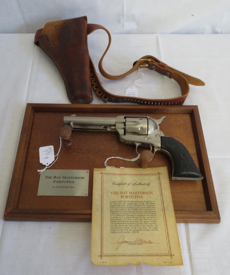 Bat Masterson Reproduction Double Action Pistol: Bat Masterson Reproduction Double Action Pistol, 20th century item. Made of wood plaque, metal, plastic and leather holster, the pistol measures 11" x 5 1/2". Franklin Mint, non-firing pistol. Hoslter