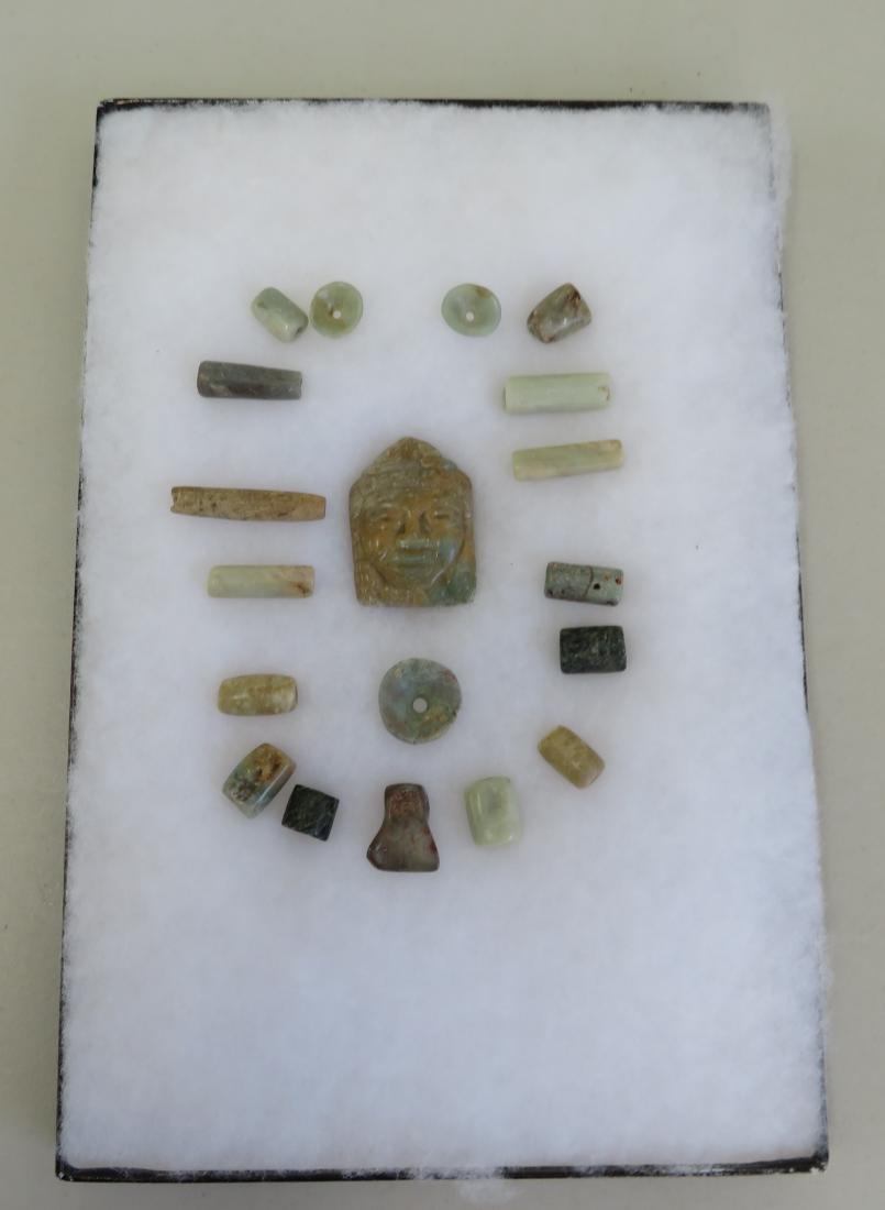 Mayan Jade Collection: Mayan Jade Collection, pre-Columbian item. Made of jade, the largest item measures 2 1/2". Guatemala. Effigy pendant, pair of tiny ear spools. Frame not included. Condition: Good, see images. Shipping