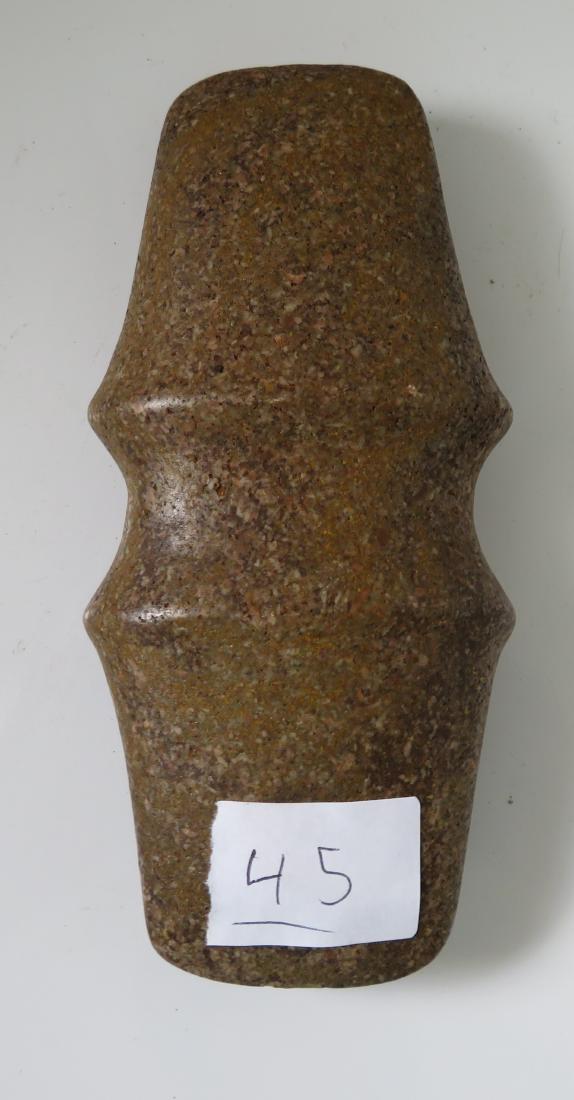 Double-Bitted Stone Axe: Double-Bitted Stone Axe, pre-historic item. Made of porphyry, the item measures 6 3/4" x 3" x 1 1/2". Midwest USA. Condition: Good, see images. Shipping: $20.00 w/insurance and signature.