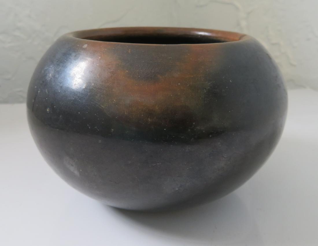 J & D Tofoya Olla: J & D Tafoya Olla, 1974. Made of clay and paint, the item measures 5 1/4" x 5 1/4" x 3 1/2". San Ildefonso Pueblo, New Mexico. Juan and Donicia Tafoya. Condition: Good, see images. Shipping: $26.50 w/